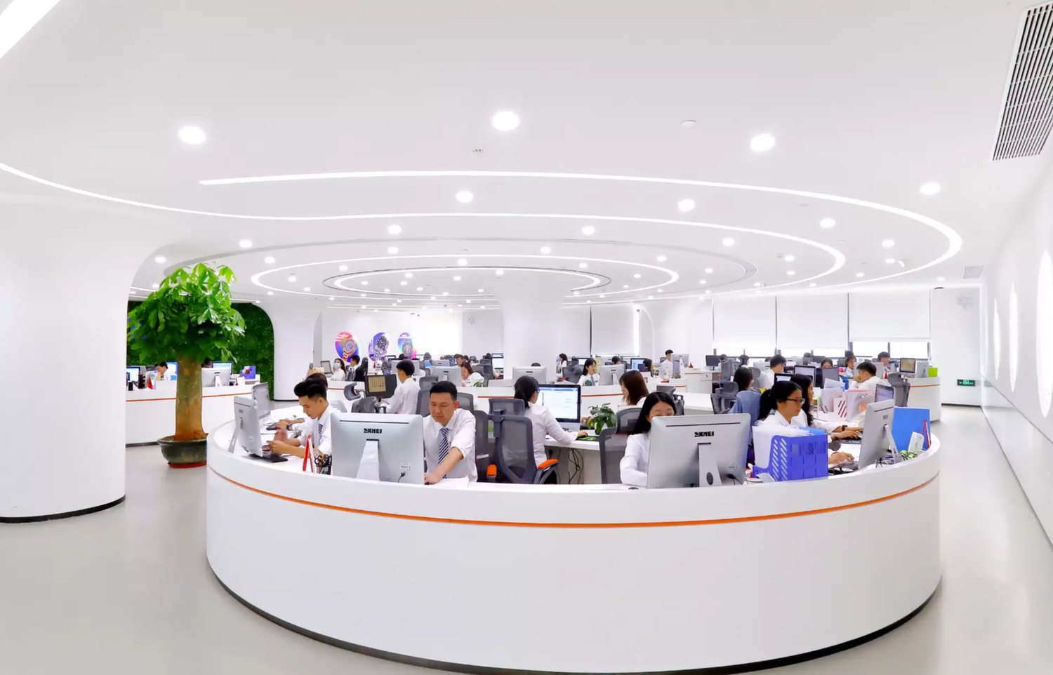 The office floor, staff at desks. SKMEI states a team of more than 300 people across R&D, design, production and sales.