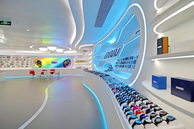 The showroom wall, the colour range laid out in a single run.